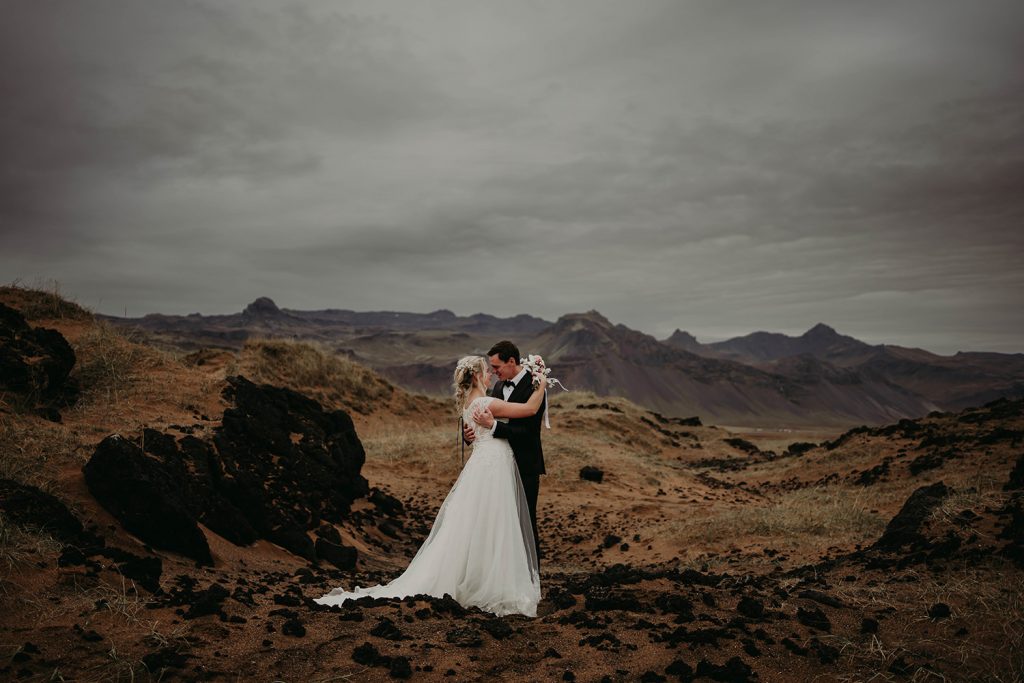 A couple at a beach in Iceland for theor elopement.