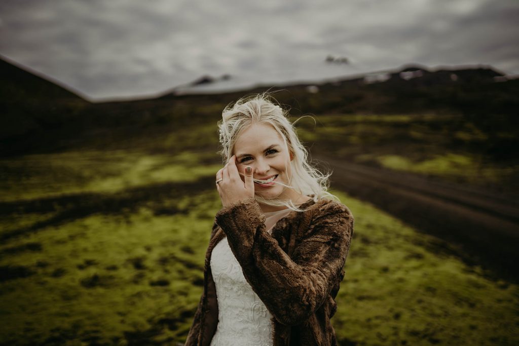 Bride with moss and mountain behind.